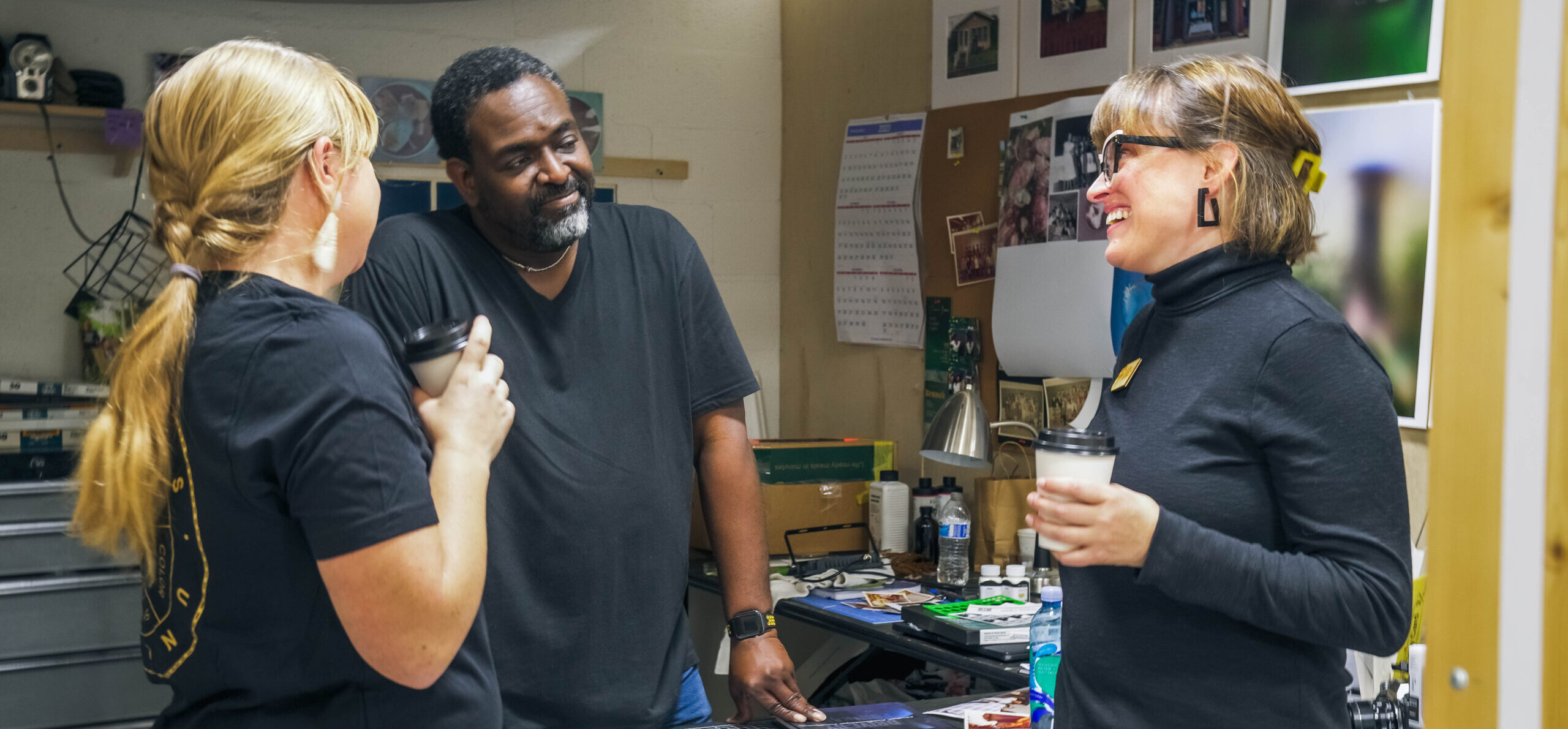 CU Board Members visiting an artist in their studio.